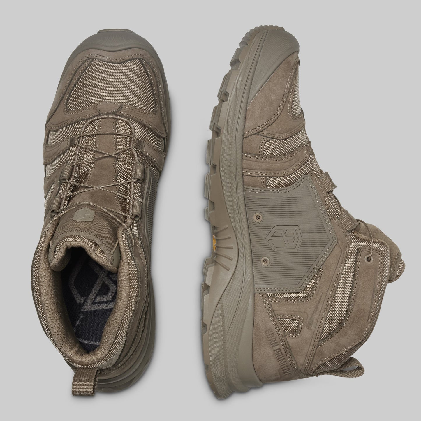 Pair of brown boots on a light gray background