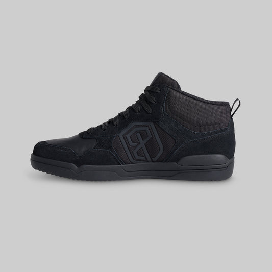 Black mid-top sneaker shown from side
