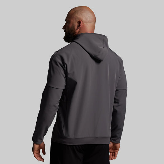 Man wearing a gray hoodie from behind on a light gray background