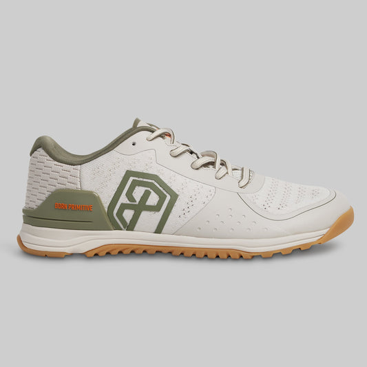 White and green sneaker with brand logo on a gray background