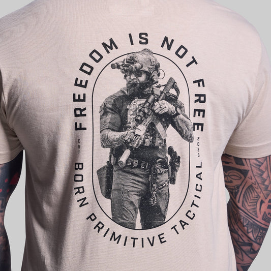 T-shirt with a graphic of a person in tactical gear and text 'Freedom is not Free' on a plain background