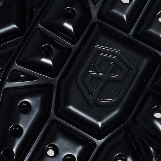 Close-up of a black knee pads with a brand logo.