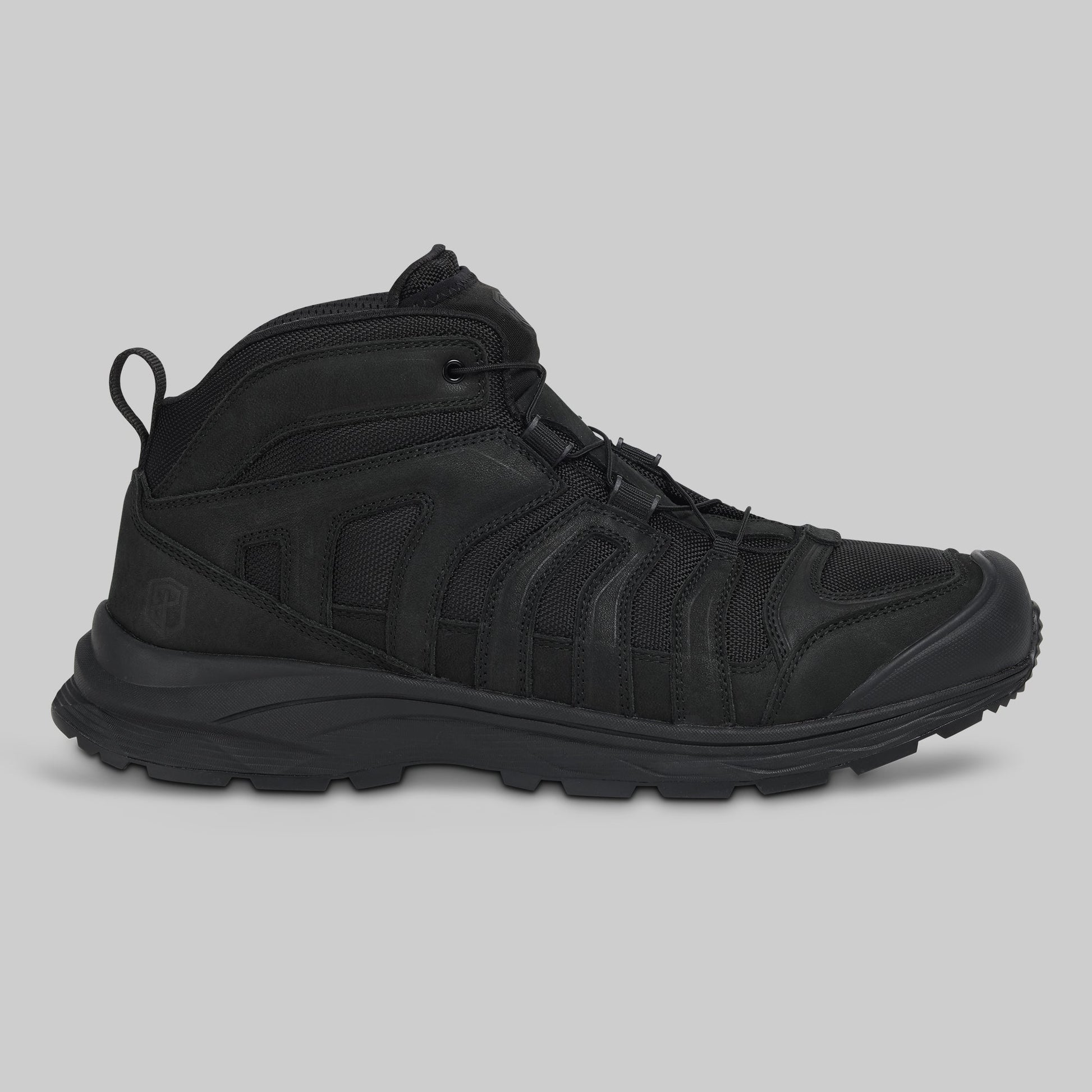 Black boot on a gray background