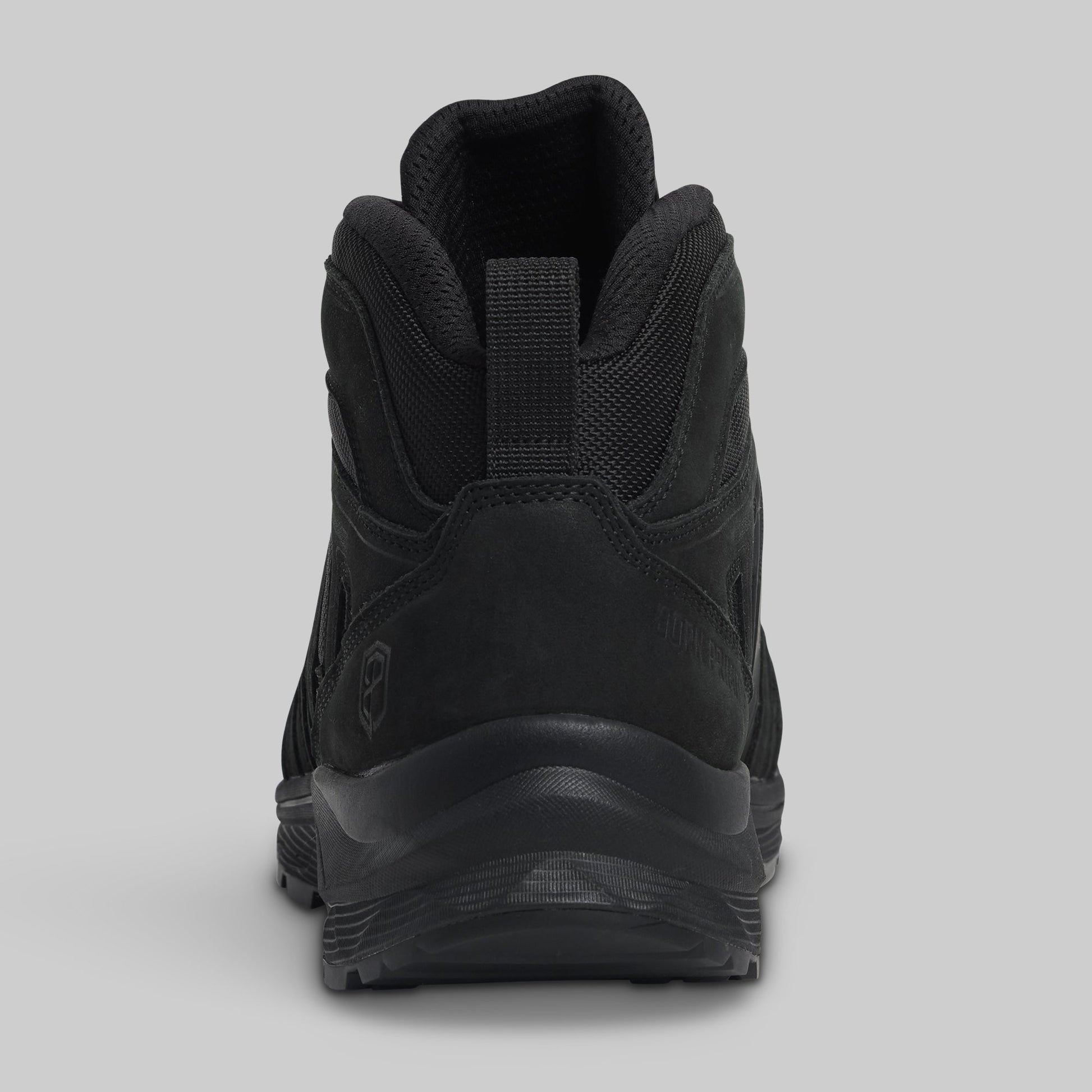Black boot on a gray background
