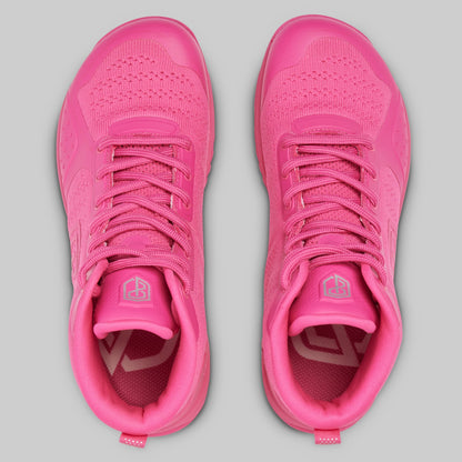 Pair of pink athletic shoes on a gray background