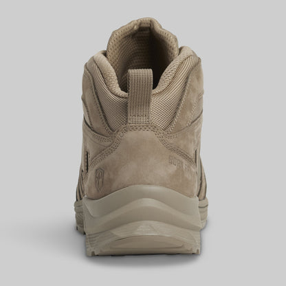Tan hiking boot on a light gray background