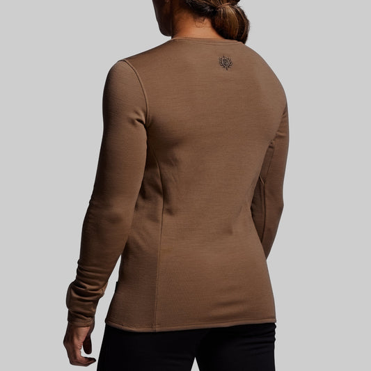 Brown long-sleeve shirt worn by a person on a light gray background