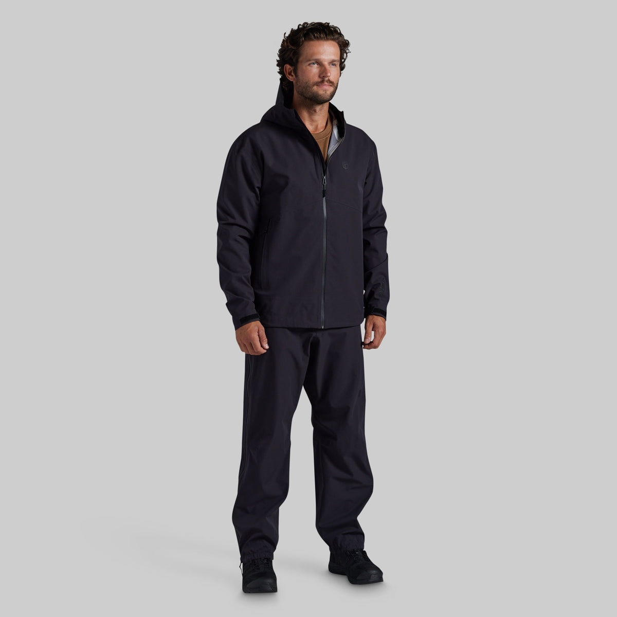 Full front view of black Mission FLEX Rain Pant 2.0 with matching rain jacket