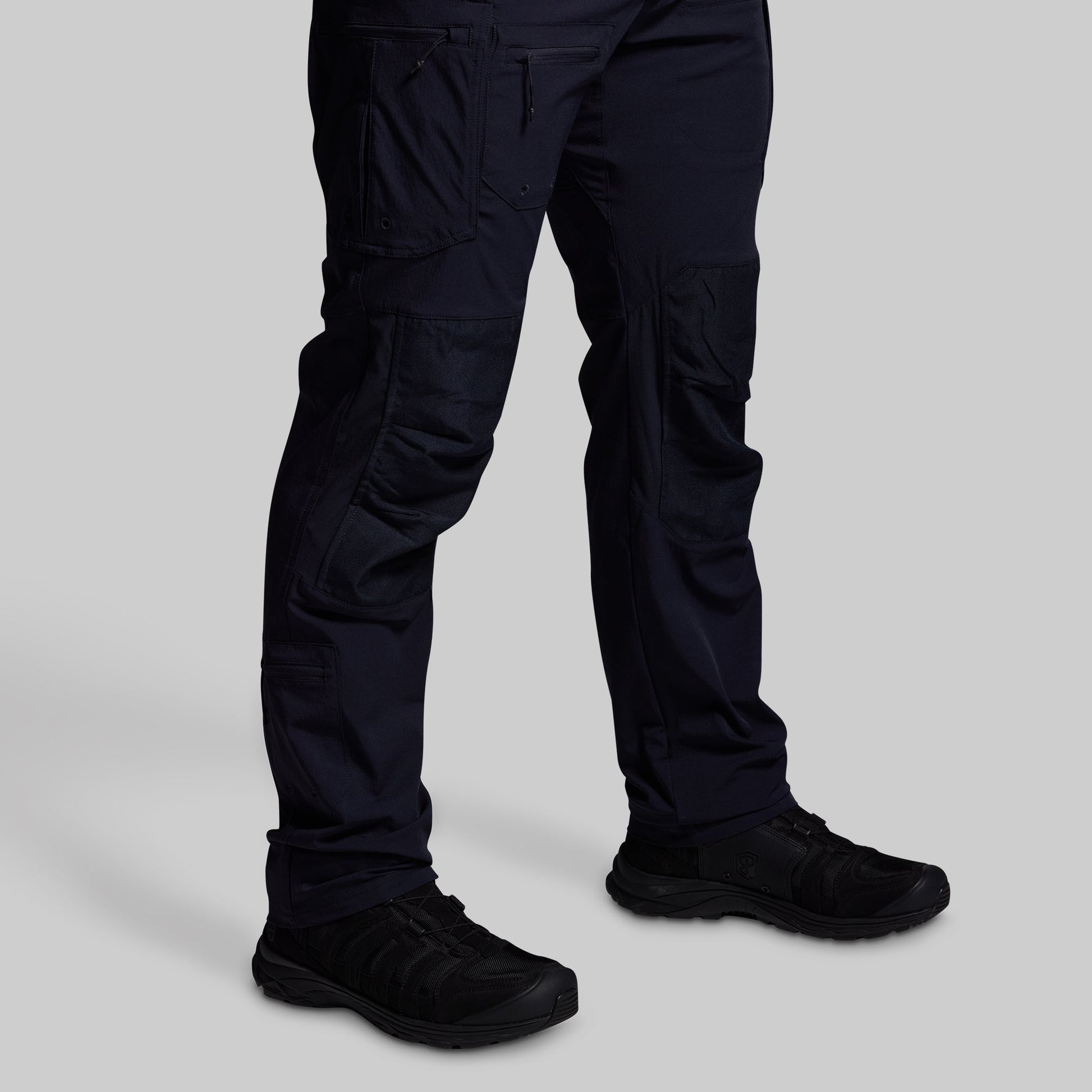 Blue pants and black shoes on a light gray background