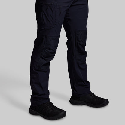 Blue pants and black shoes on a light gray background