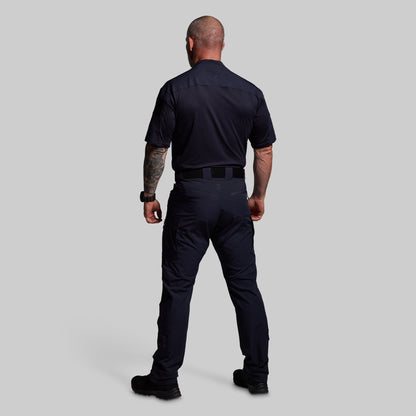 Person wearing a blue uniform on a gray background