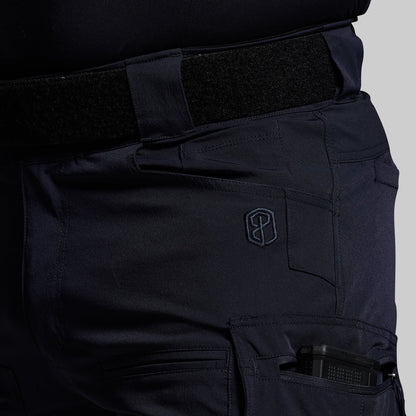 Blue tactical pants with a visible brand logo on a gray background