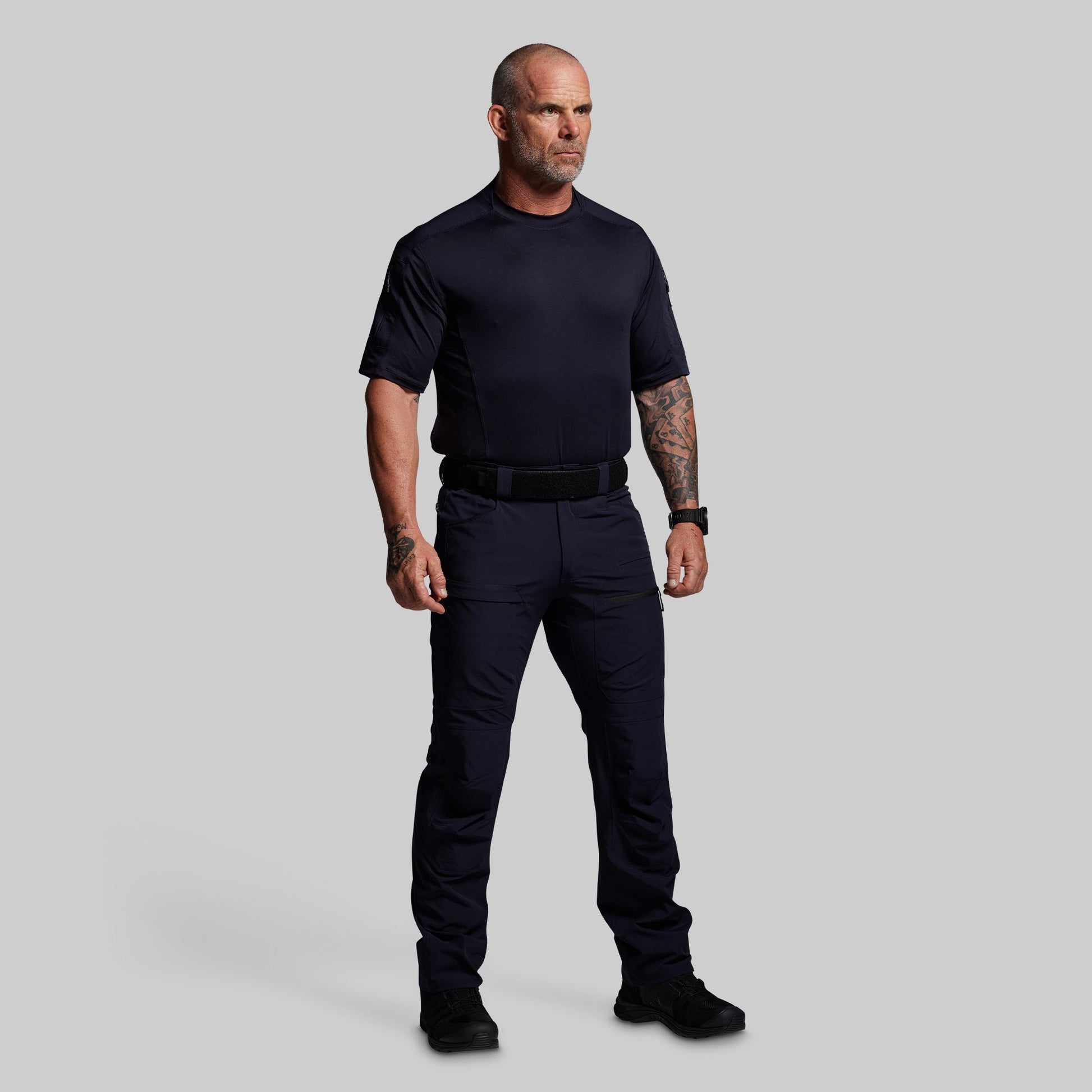 Man wearing a blue pants on a gray background