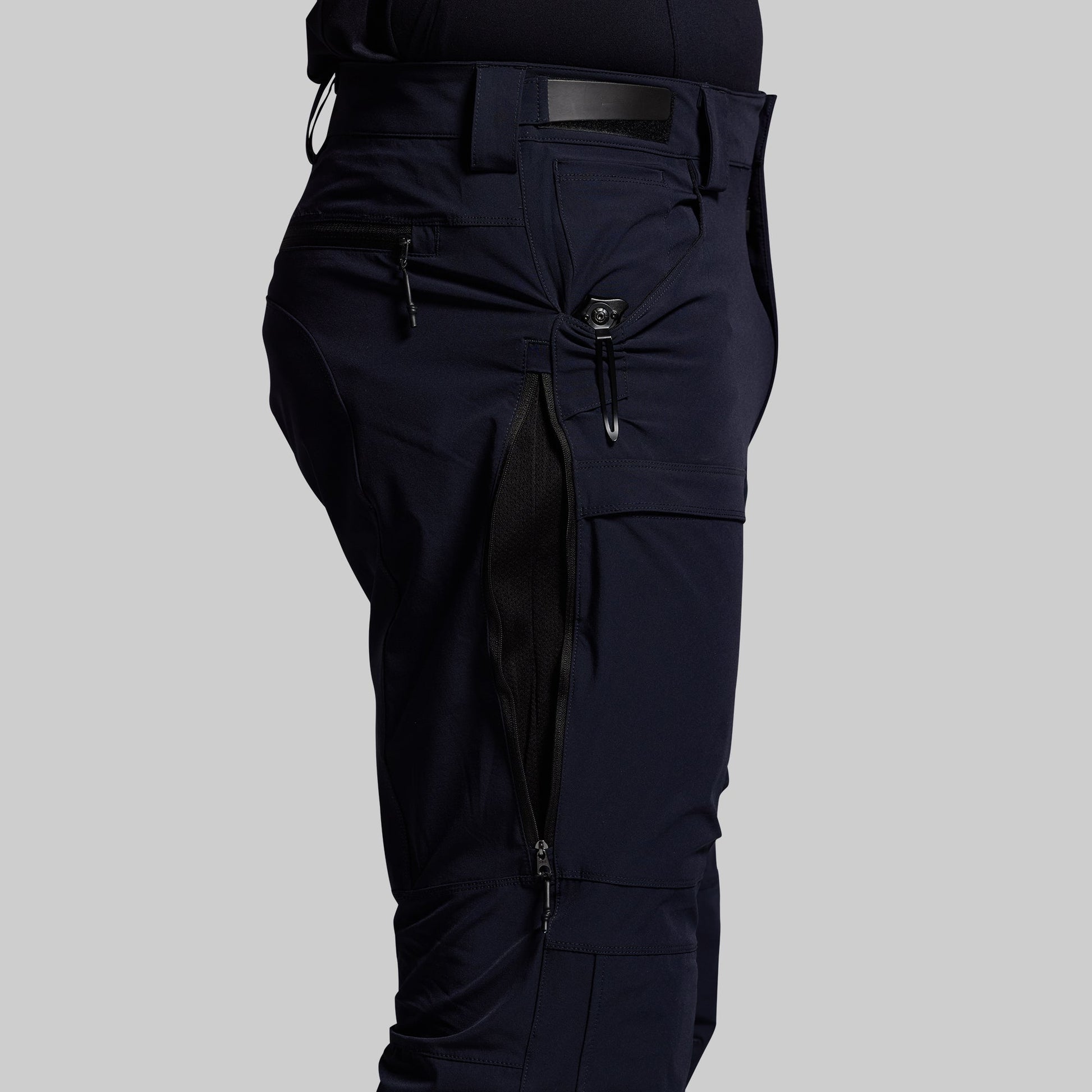 Blue outdoor pants on a gray background