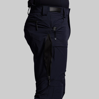 Blue outdoor pants on a gray background