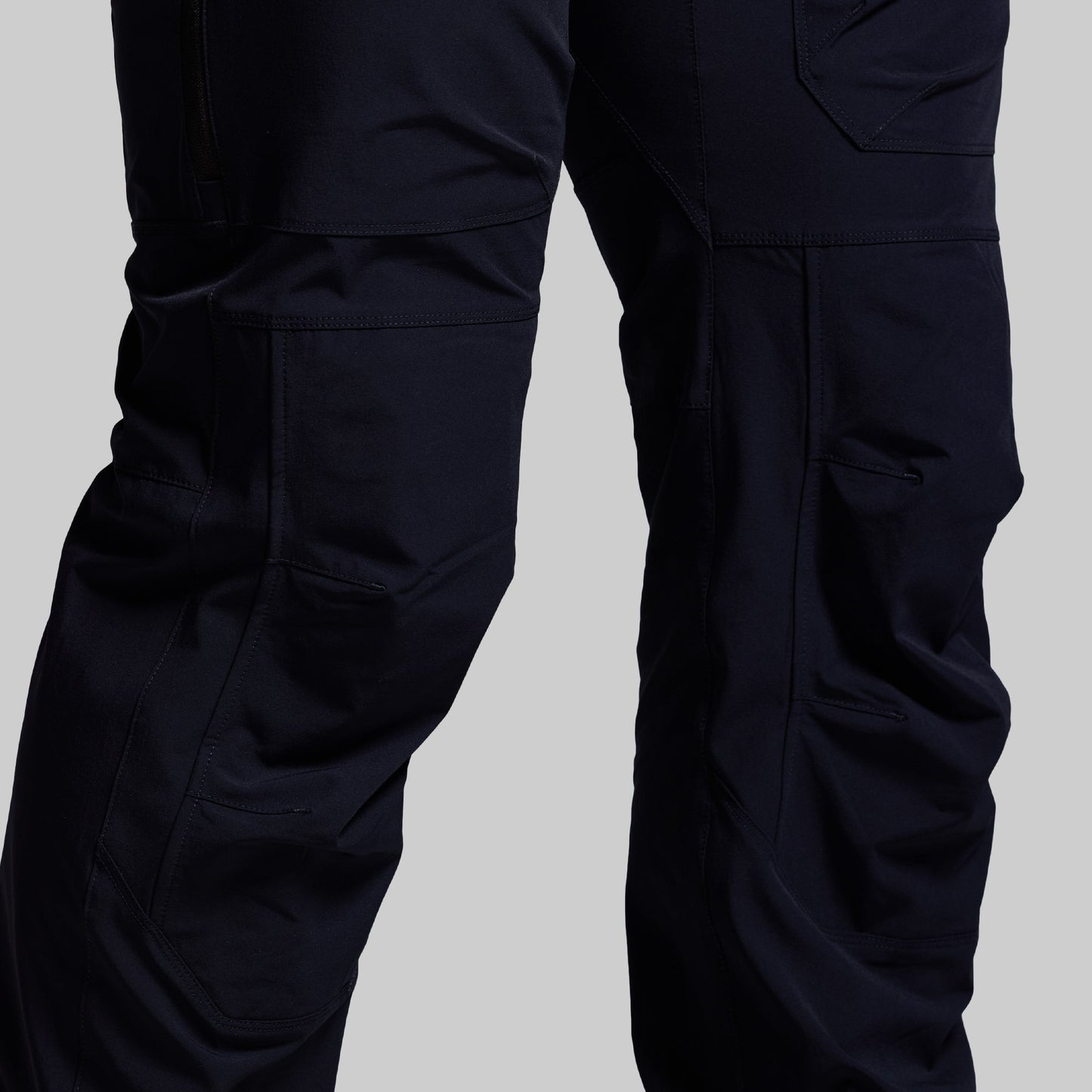 Navy blue pants on a light gray background