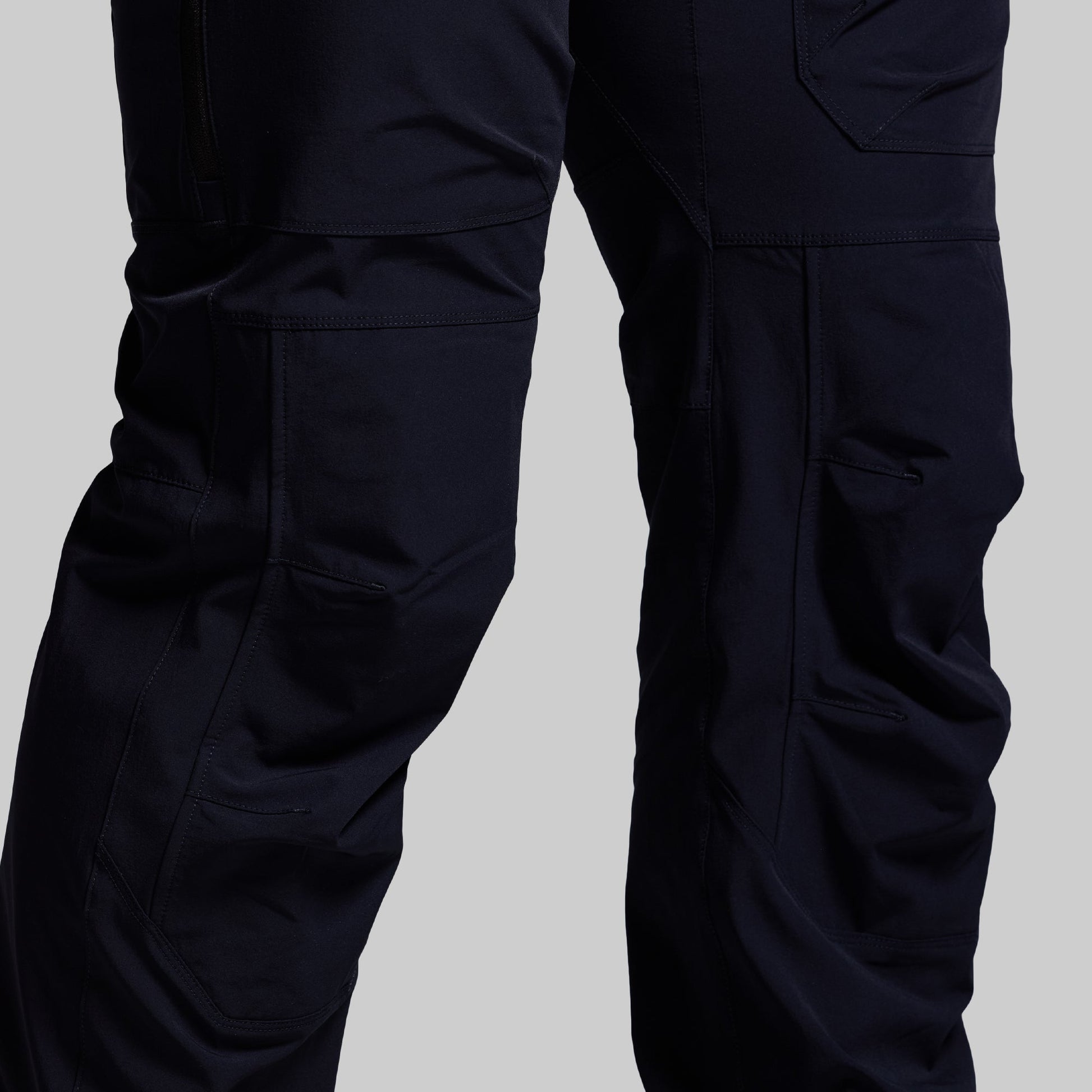 Navy blue pants on a light gray background
