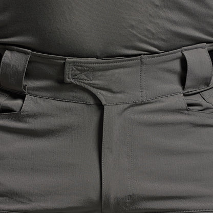 Close-up of dark gray tactical pants with multiple pockets.