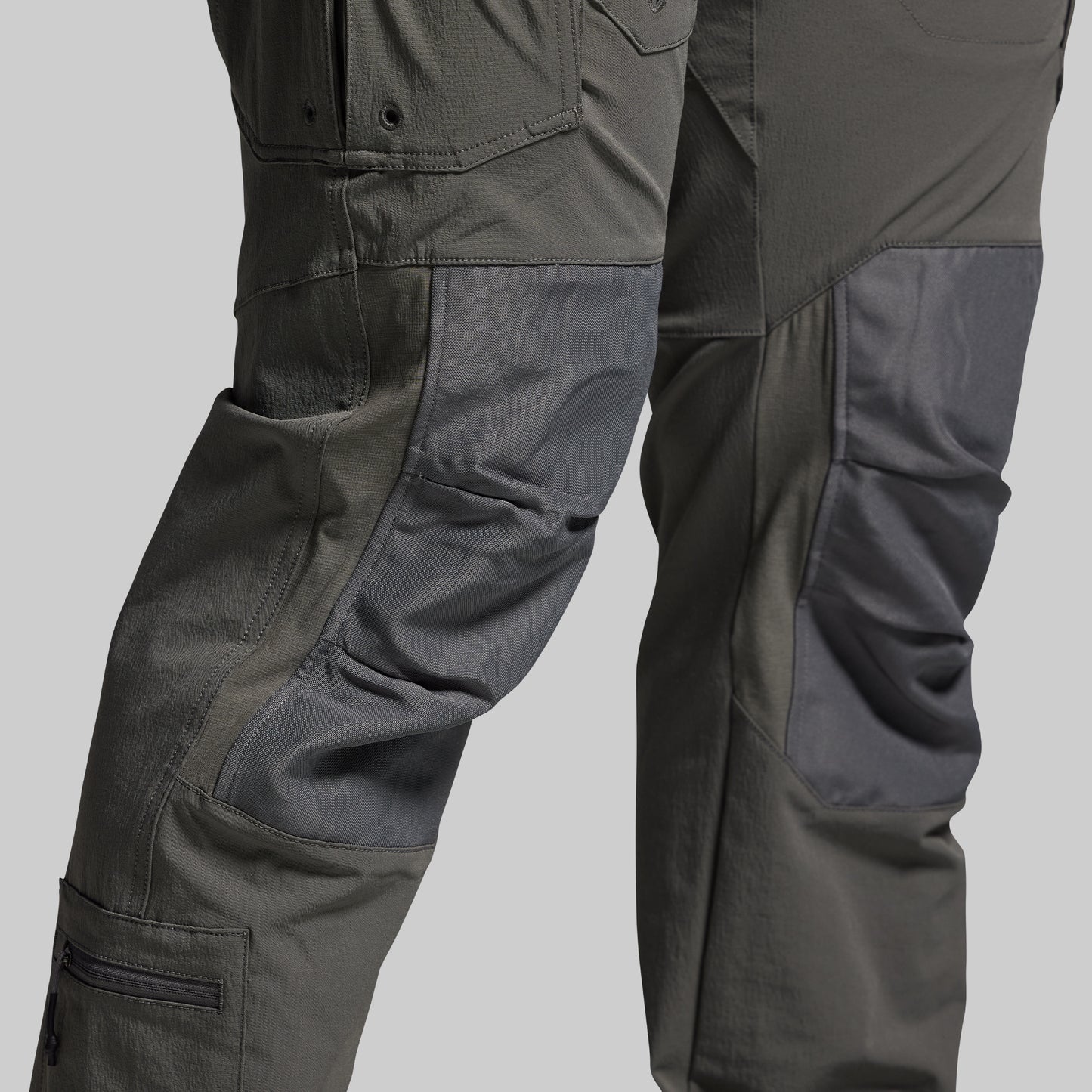 Dark gray tactical pants on a light gray background