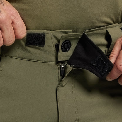 Close-up of closure on green pants.