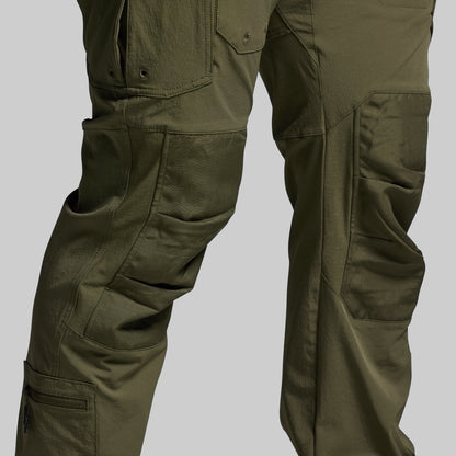 Olive green tactical pants on a light gray background
