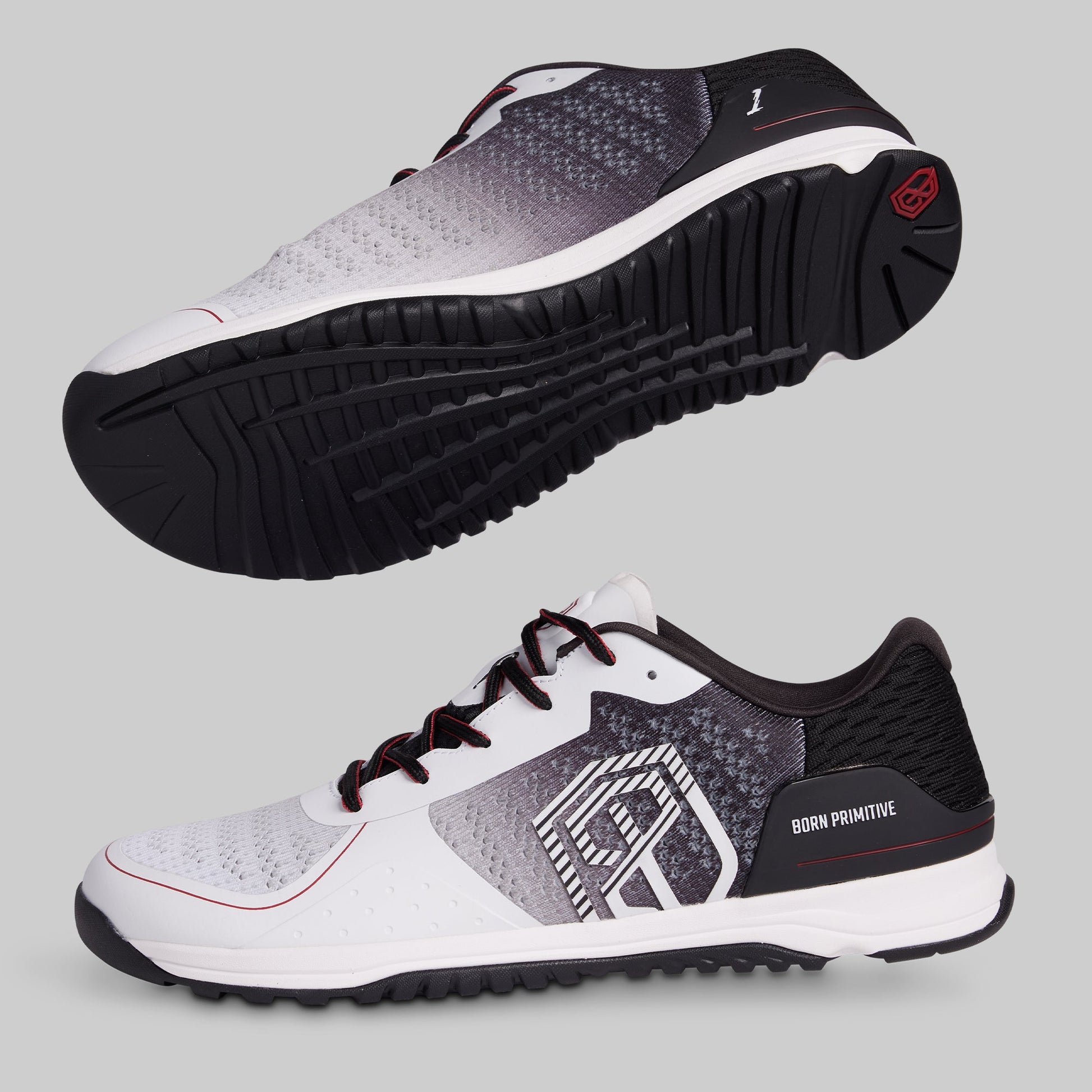 White and black athletic shoes with a visible brand logo on a gray background