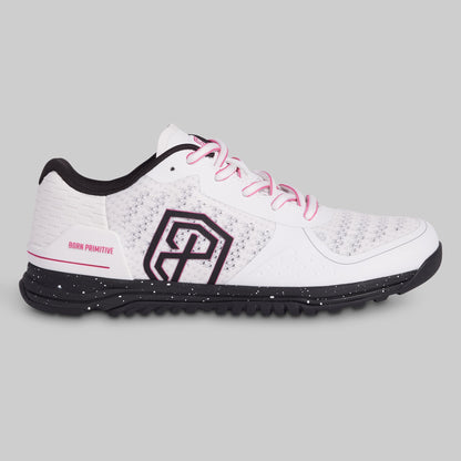 White athletic shoe with black sole and pink laces on a gray background