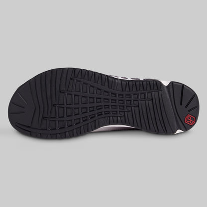 Black sole of a sneaker on a gray background