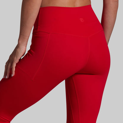 Red leggings with a brand logo on a gray background