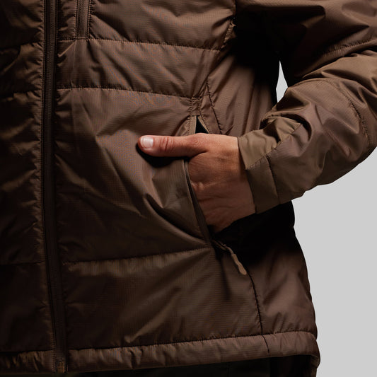 Brown puffer jacket with a hand reaching into a pocket against a neutral background