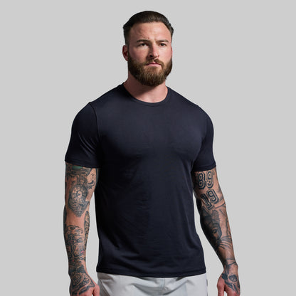 Man wearing a black t-shirt against a plain background
