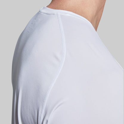 Close-up of a white t-shirt seam on shoulder worn by a person.