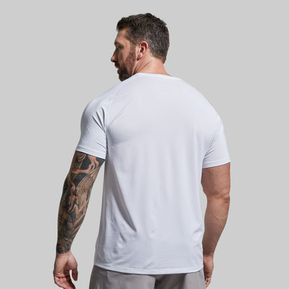 Man wearing a white t-shirt against a plain background