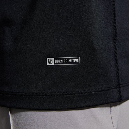 Close-up of brand logo on a black t-shirt.