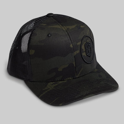 Black camouflage baseball cap with a logo on a gray background