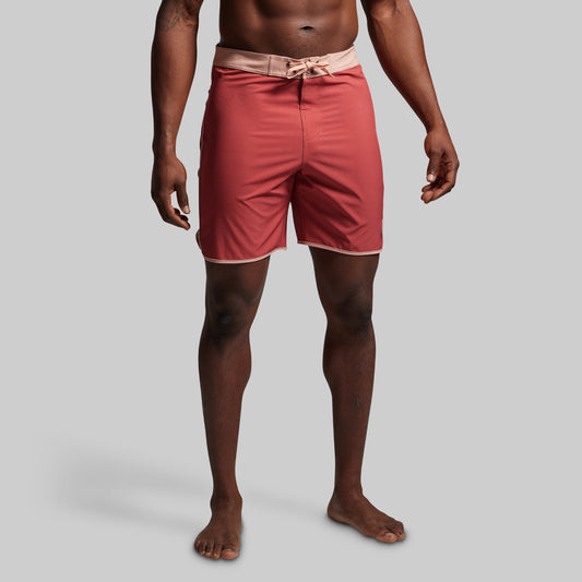 Person wearing red shorts on a gray background