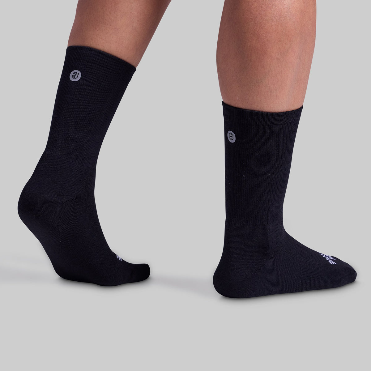 Performance Crew Sock (Black): rear and side fit on feet.