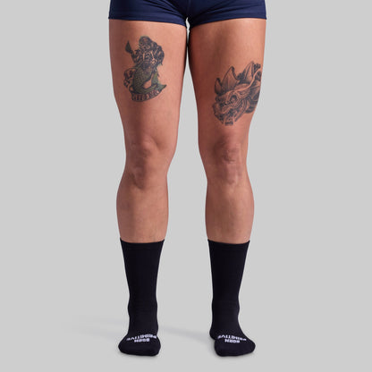 Performance Crew Sock (Black): front view worn on a model.