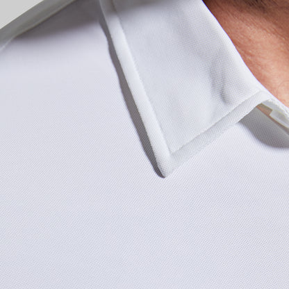 Close-up of a white polo shirt with a collar