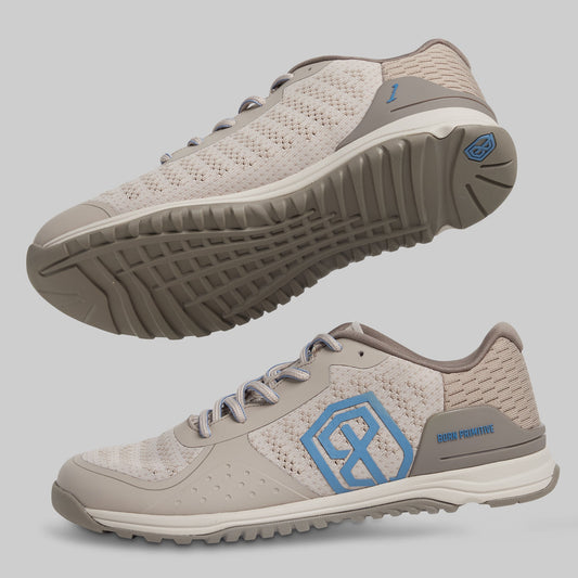Beige and brown athletic shoes with a blue logo on a gray background