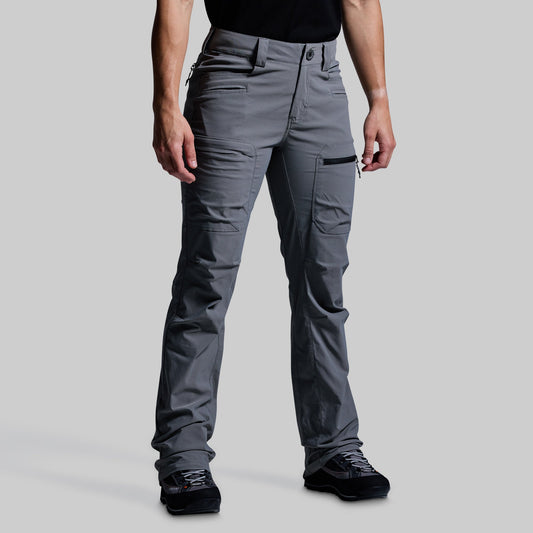 Person wearing gray outdoor pants on a light gray background