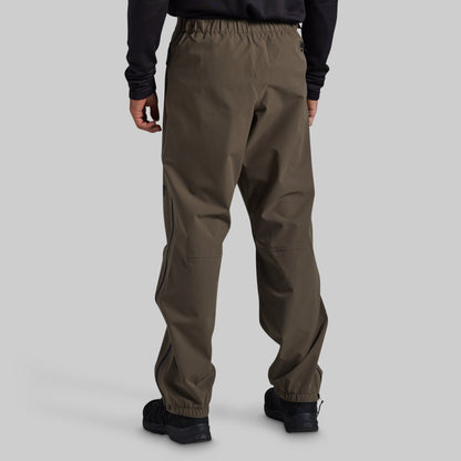 Man wearing Ranger Green Mission FLEX Rain Pant 2.0, back view