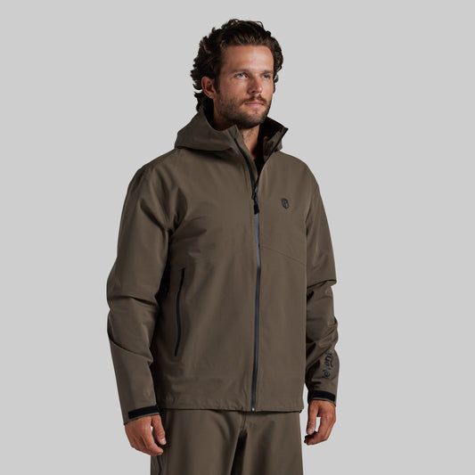 Man wearing the Ranger Green Mission FLEX Rain Jacket 2.0, front view with hood down