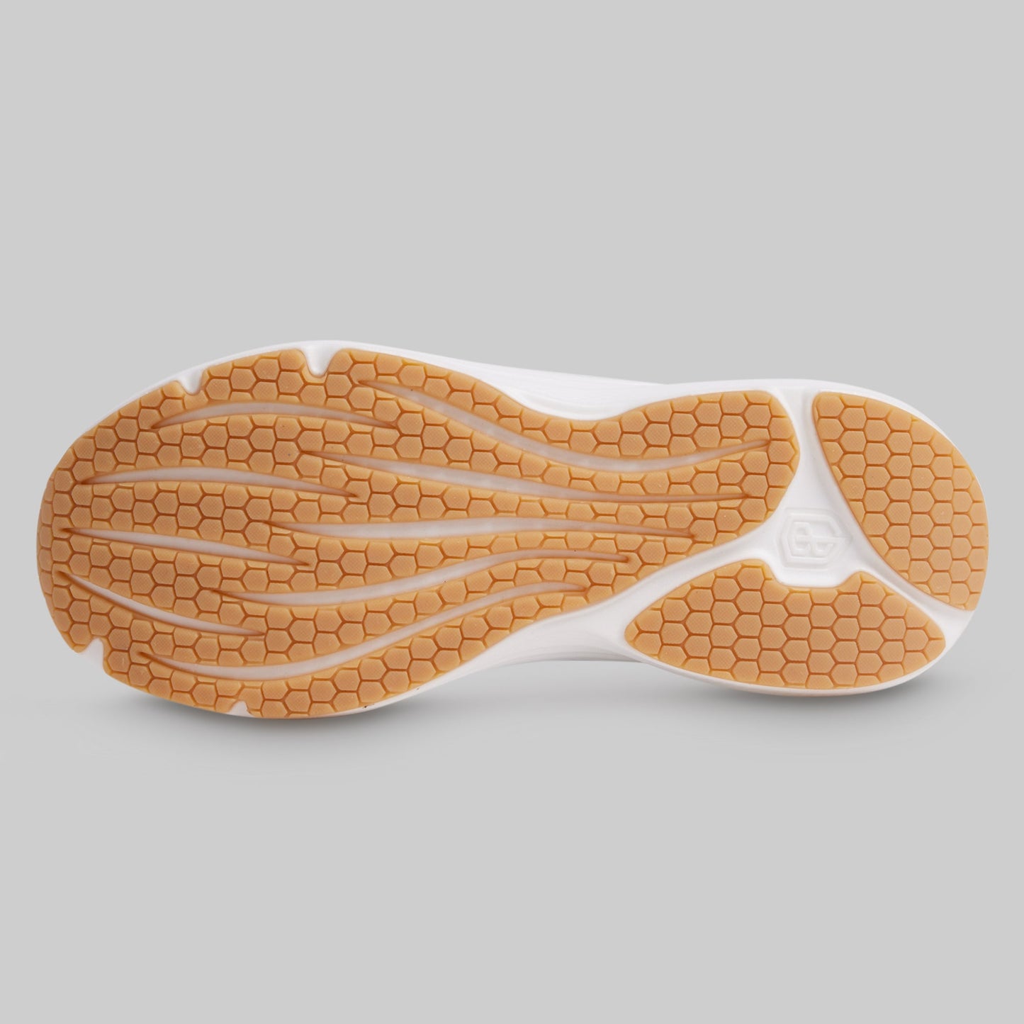 Close-up of a shoe sole with a textured pattern on a gray background