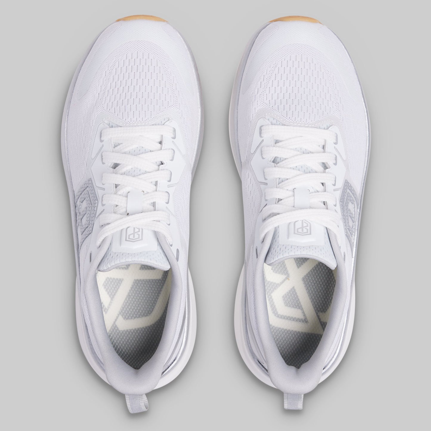 White athletic shoes on a gray background