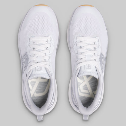 White athletic shoes on a gray background