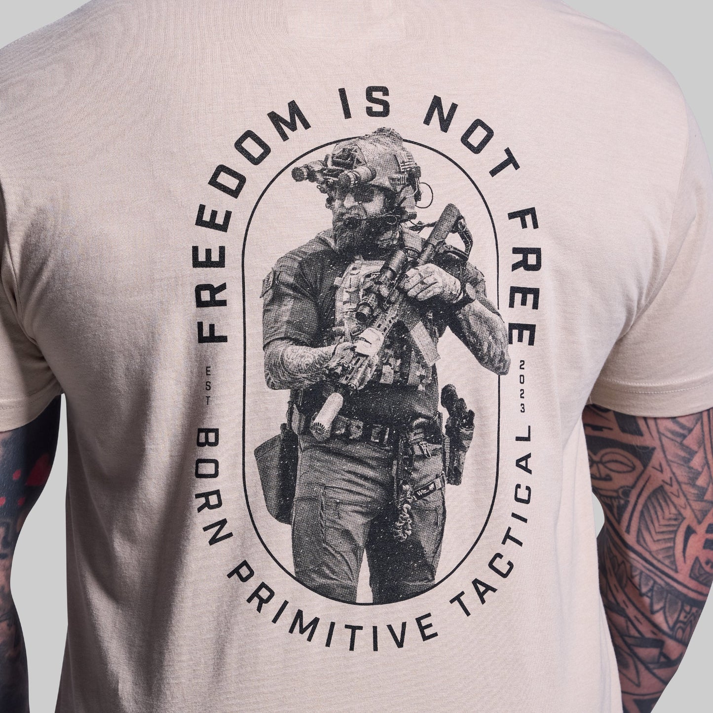 T-shirt with a graphic of a person in tactical gear and text 'Freedom is not Free' on a plain background