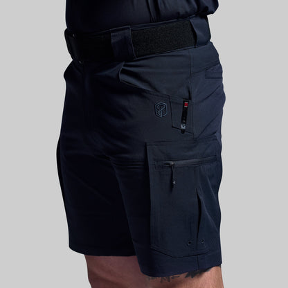 Blue tactical shorts with multiple pockets on a gray background