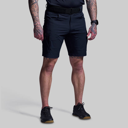 Person wearing blue shorts on a gray background