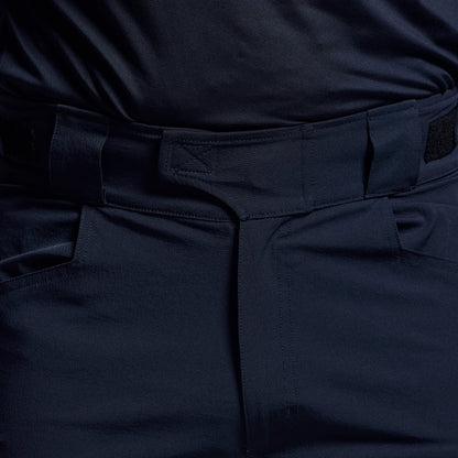 Close-up of the waistband on dark blue tactical shorts.